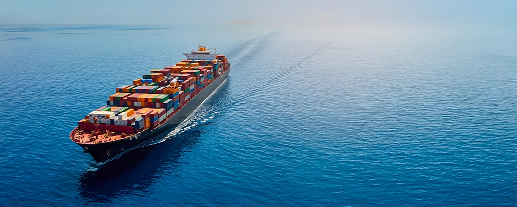 Cargo ship at sea aerial view