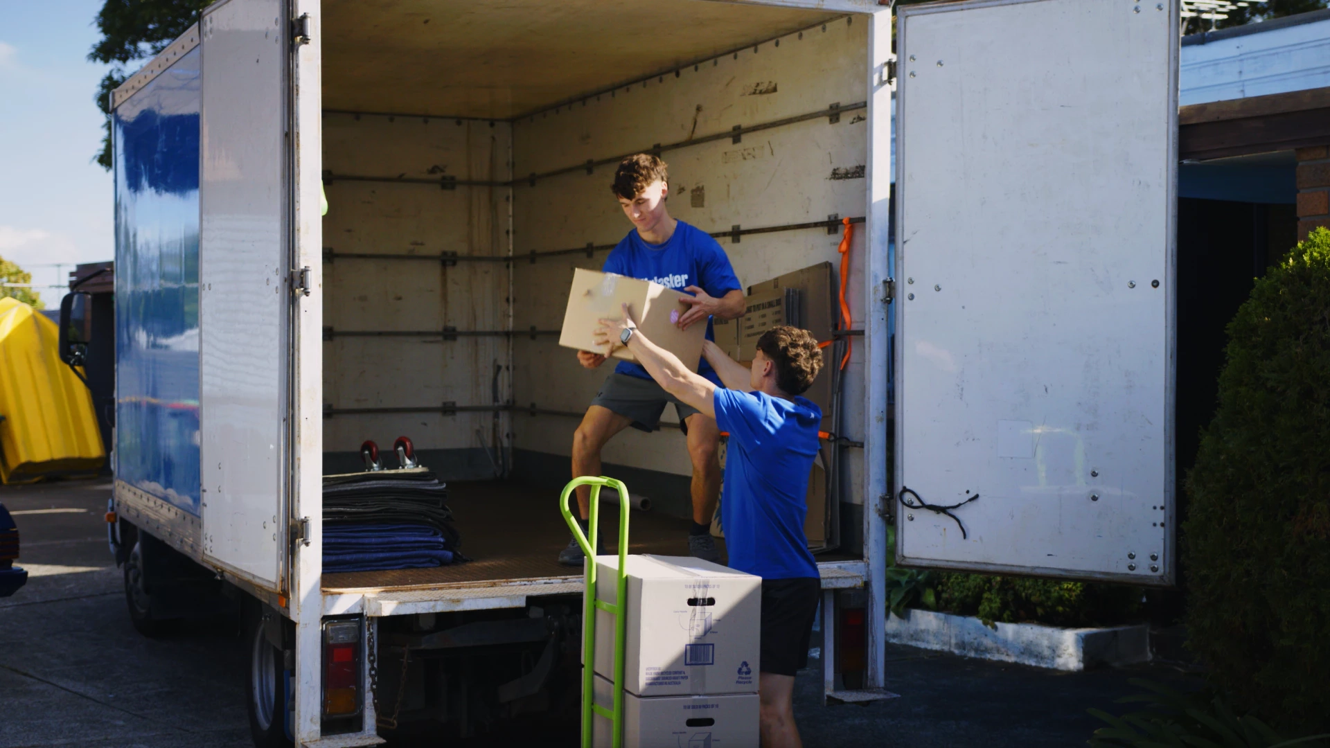 Moving boxes and furniture being prepared for shipping