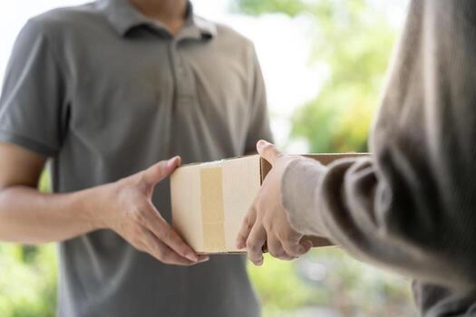 Happy family receiving a package at door